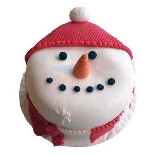 Snowman themed cake with red hat, carrot nose, and fondant decorations for birthdays