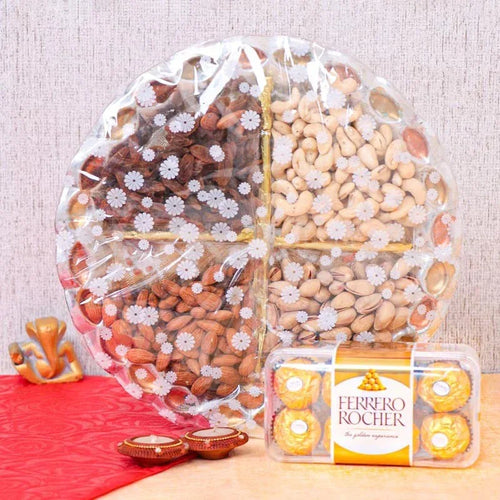 Assorted nuts in a clear plastic wrap with a box of Ferrero Rocher chocolates on a wooden surface.