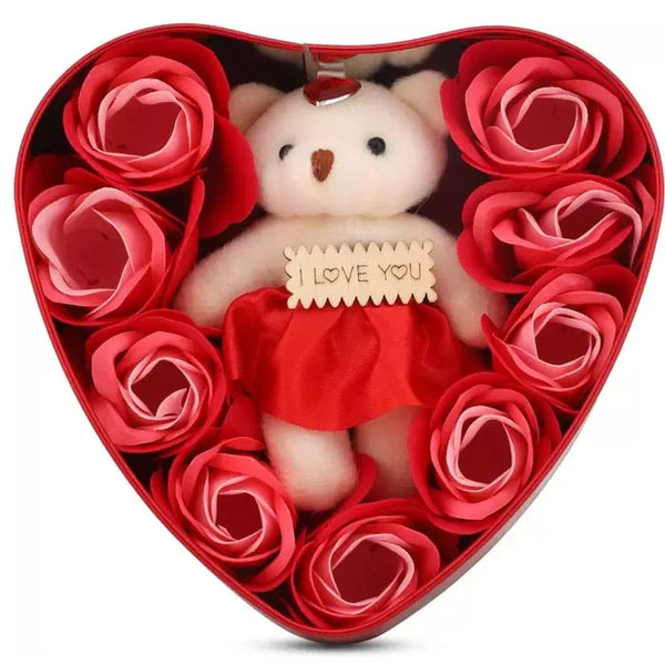 Heart-shaped gift box with red roses and a teddy bear holding 'I Love You' sign