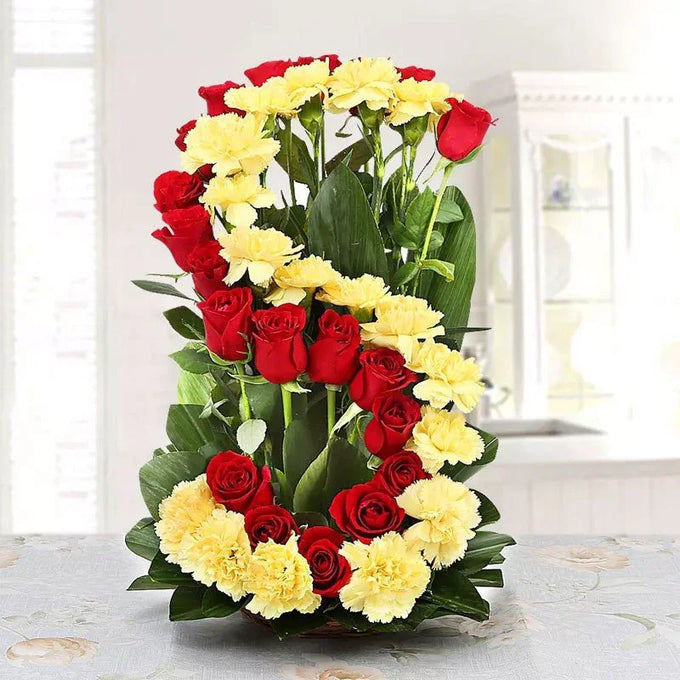 Basket Arrangement of 20 Red Roses & 20 Yellow Carnations - Flower Delivery in GiftsGhaziabad