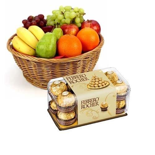 Gift basket with assorted fresh fruits and Ferrero Rocher chocolates, ideal for celebrations