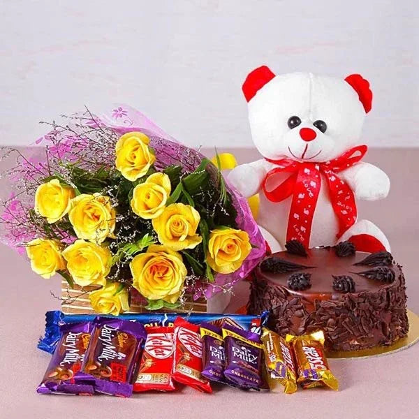 Yellow rose bouquet, chocolate cake, assorted chocolates, and a white teddy bear gift combo