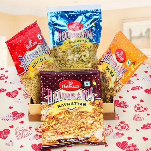Assorted Haldiram's snacks including Navrattan, Bhujia, Dal Biji, and Kashmiri Mixture.