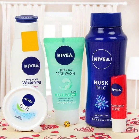 Nivea skincare gift set with face wash, body lotion, talc, soft cream, and lip balm.