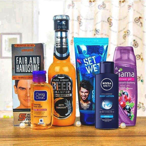 Collection of men's grooming products on a wooden surface with a blurred background