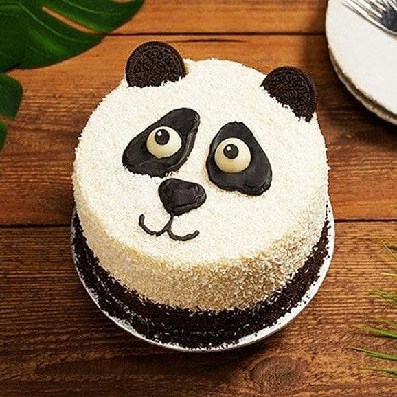 Panda-shaped cake on a wooden table
