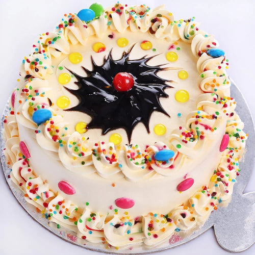 Colorful cake with icing and sprinkles 