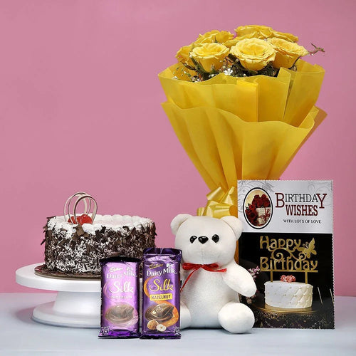 Bouquet of yellow roses, birthday cake, teddy bear, and chocolate 