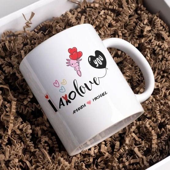 White mug with decorative text and graphics on a bed of brown crinkle paper