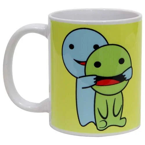 White ceramic mug with cartoon blue and green hugging characters on a yellow background