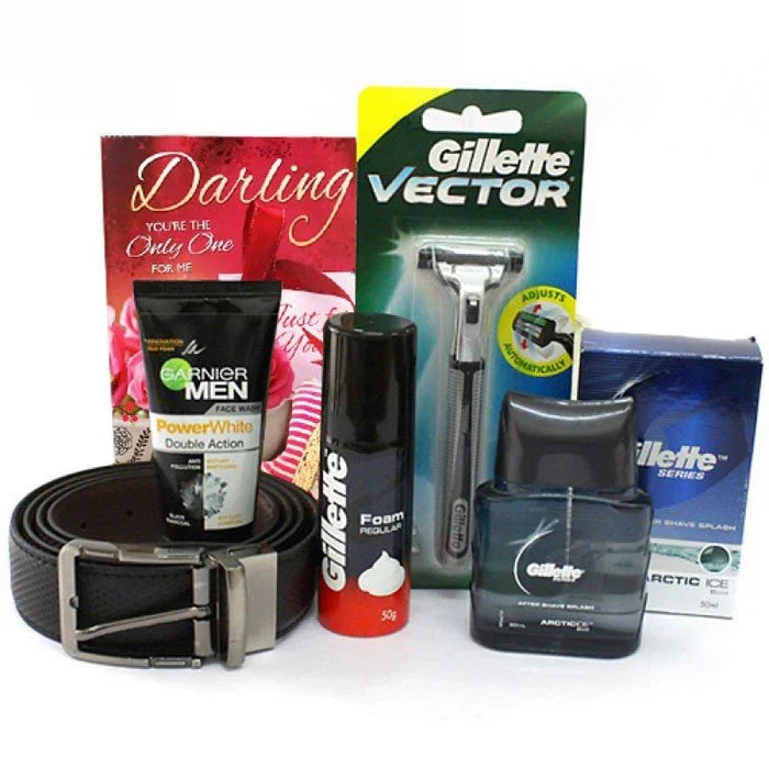 Men's grooming gift set with razor, face wash, shaving foam, belt, card, and aftershave
