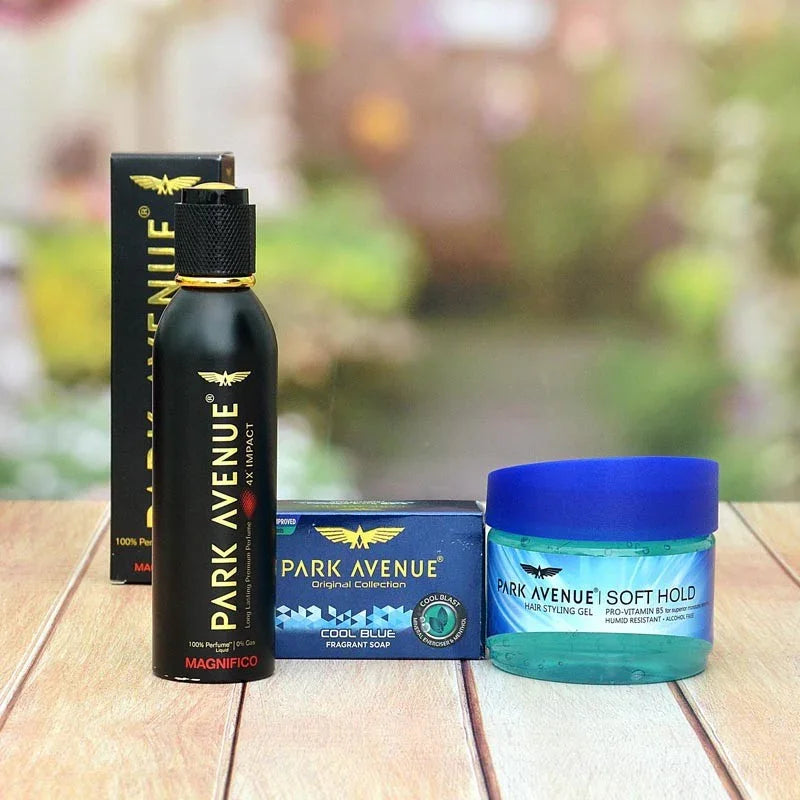 Park Avenue grooming products including a bottle, soap, and gel on a wooden surface with a blurred natural background.