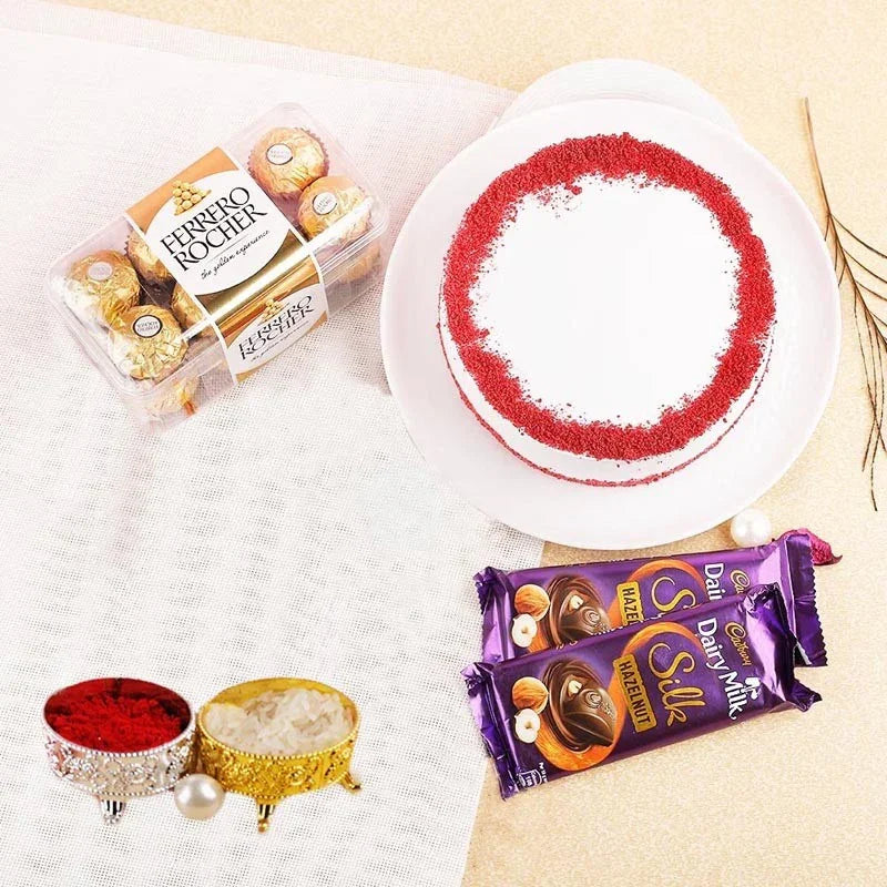 Ferrero Rocher and Cadbury Dairy Milk Silk chocolates with a red and white cake on a light background