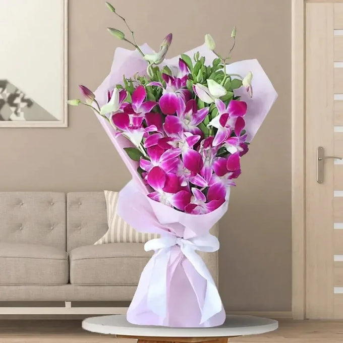 Purple Orchid Bouquet with Green Fillers & Pink Ribbon - Flower Delivery in Kalyani