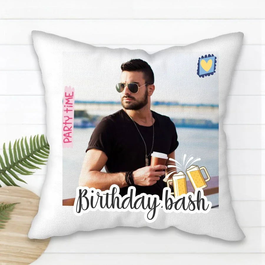 Pillow with a man holding a drink, text 'Birthday bash', and graphics on a white background.