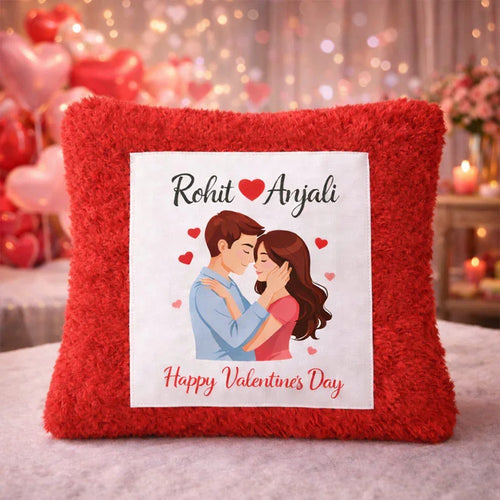 Red pillow with a printed design of a couple and personalized text on a blurred romantic background.