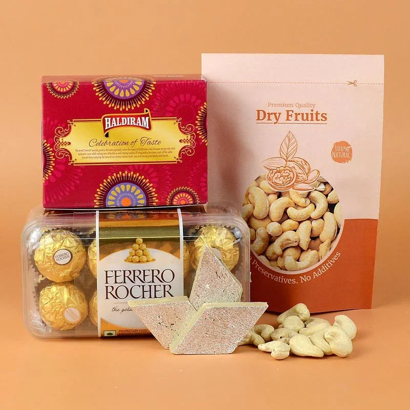 Assorted snacks including a box of Balratham, Ferrero Rocher, and a container of dry fruits on an orange background.