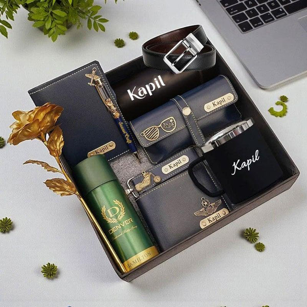 Collection of branded items including a mug, thermos, and wallets with 'Kapil' branding on a light background.