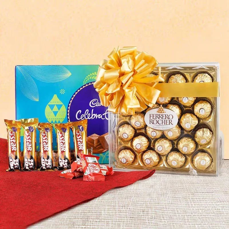 Ferrero Rocher chocolate set with a large yellow bow and Nestle Star bars on a red cloth.