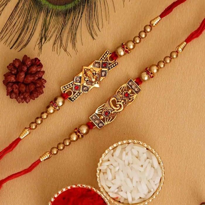 Ganesha Om Rakhi Set  (2 N Rakhi, 1 Roli Chawal)