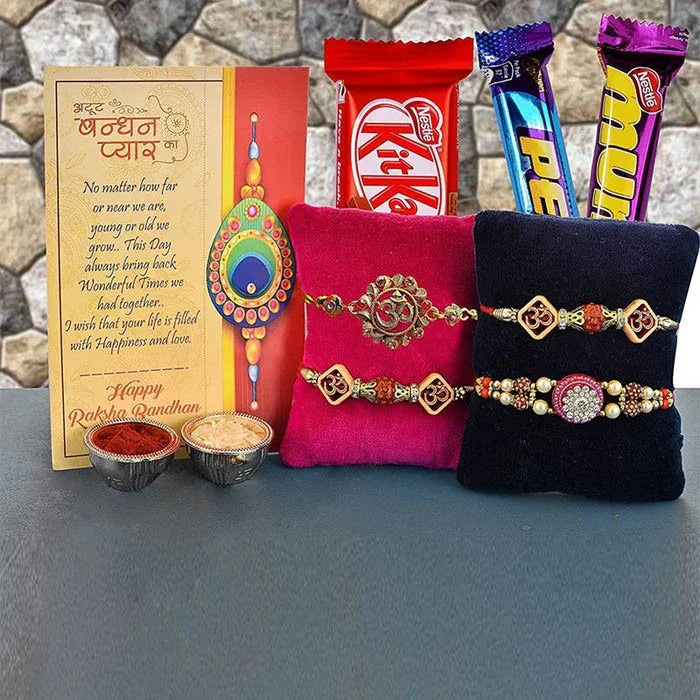 Rakhi set with colorful ribbons, rakhi, and chocolate bars on a stone surface