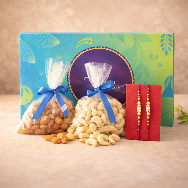 Gourmet gift set with cashews, almonds, and a decorative card on a beige background