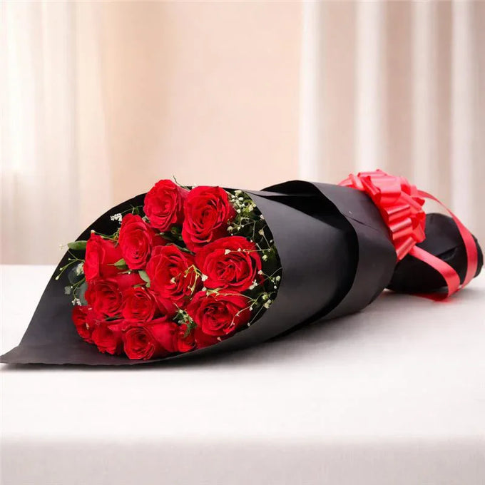 12 Red Roses Bouquet in Black Paper Wrap - Flower Delivery in GiftsGhaziabad