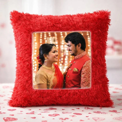 Red decorative pillow with a photo of a couple 