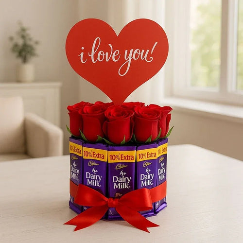 Dairy Milk chocolate bars arranged in a bouquet with red roses and a heart-shaped 'I love you' sign.