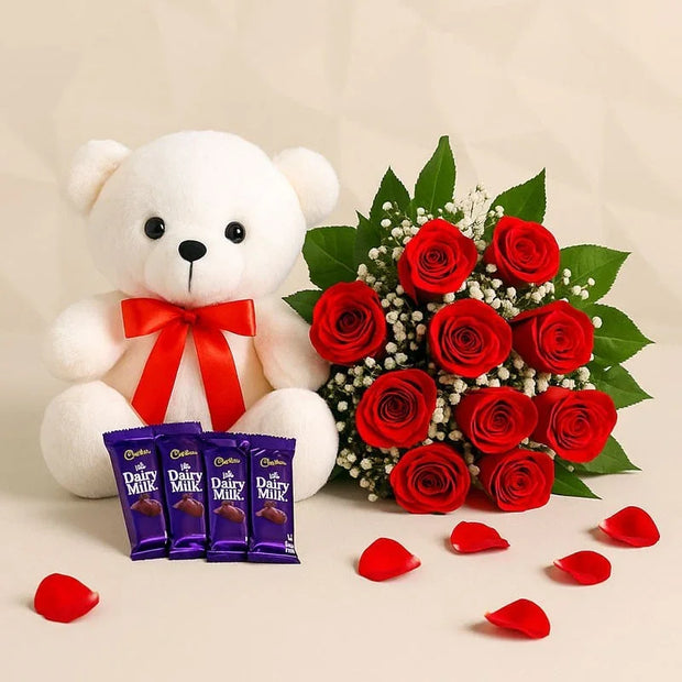 Red roses bouquet with small white teddy bear and Dairy Milk chocolates, perfect for gifting.