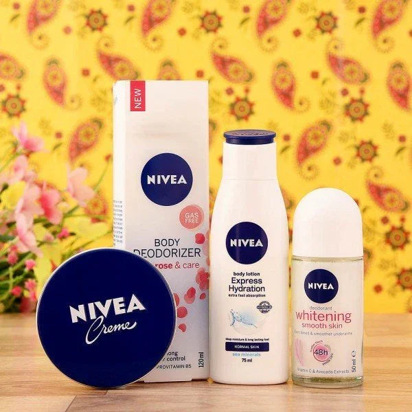 Nivea skincare gift set with body deodorizer, lotion, creme, and roll-on on wooden table