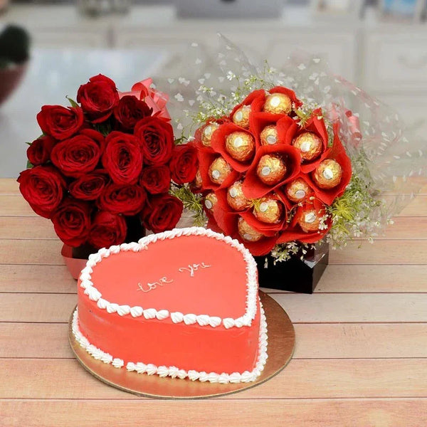 Heart-shaped cake with 'Love You' message, red roses, and Ferrero Rocher bouquet on a wooden table.