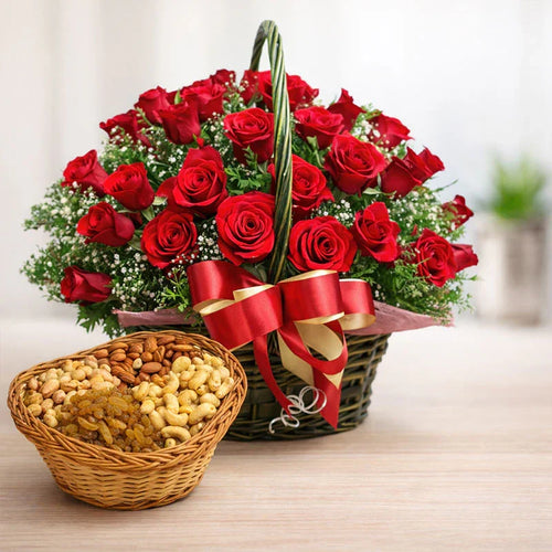 Basket of red roses with a red ribbon and a basket of Dry Fruits on a light surface.