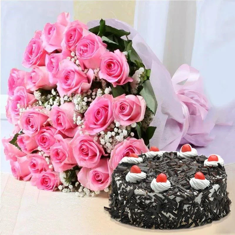 Bouquet of pink roses and a black forest cake on a light background