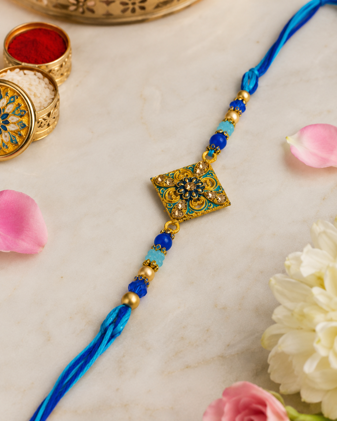 Royal Blue Floral Designer Rakhi alternate angle with petals and roli chawal
