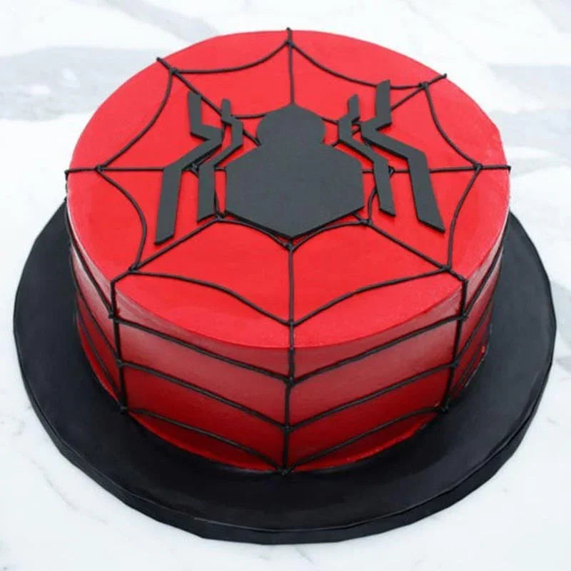 Spider-Man themed cake with red and black design on a white background