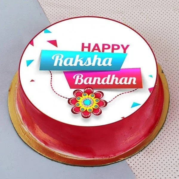 Round Raksha Bandhan cake with red icing, festive printed topper, and rakhi design