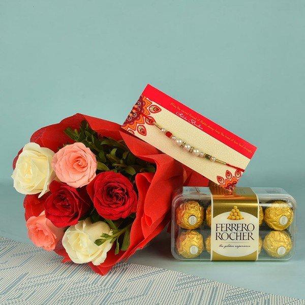 Bouquet of red, pink, and white roses with Rakhi and Ferrero Rocher chocolates gift set