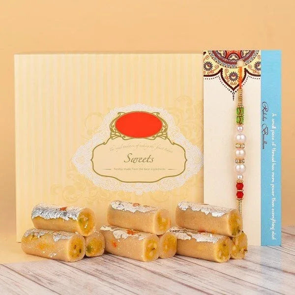 Box of Indian sweets and a traditional rakhi with beads, perfect for Raksha Bandhan gifting.