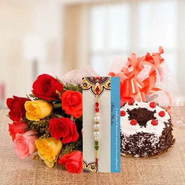 Rakhi with red and yellow rose bouquet and chocolate cake with cherry topping