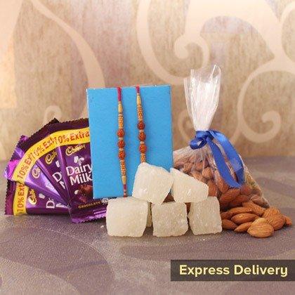 Rakhi gift set with chocolates, rakhi threads, sweets, and almonds for express delivery