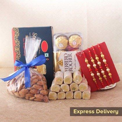 Gift hamper with sweets, dry fruits, Ferrero Rocher chocolates, and designer rakhis