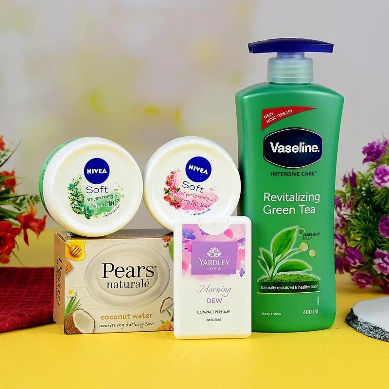 Collection of Pears, Nivea, and Vaseline products on a yellow surface with flowers in the background.