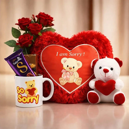 Gift set with red roses, heart-shaped pillow, teddy bear, mug, and chocolate on a beige background