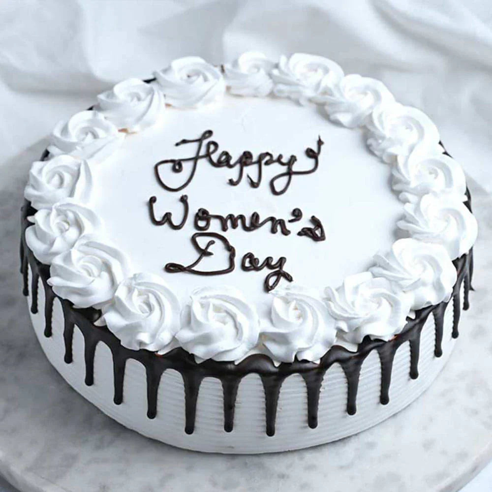 Cake with 'Happy Women's Day' text on a white background