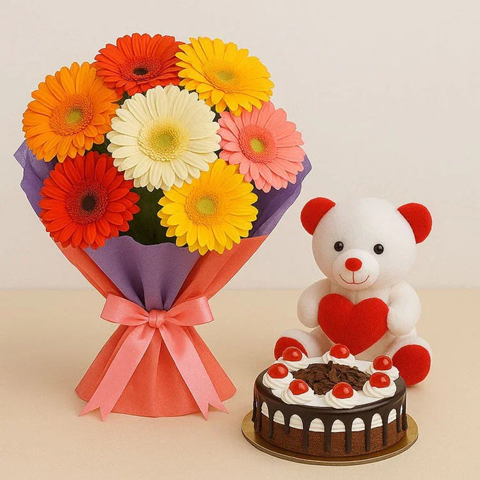 12 Pink Gerberas & Cake Hamper with 6 Inch Teddy | OyeGifts - Flower Delivery in GiftsGhaziabad