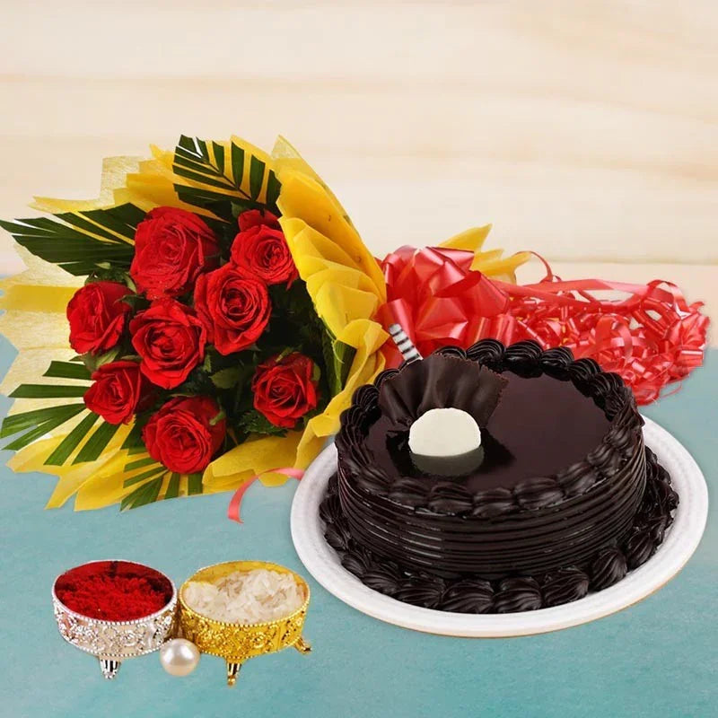Chocolate cake with a bouquet of red roses and two small bowls on a light blue background