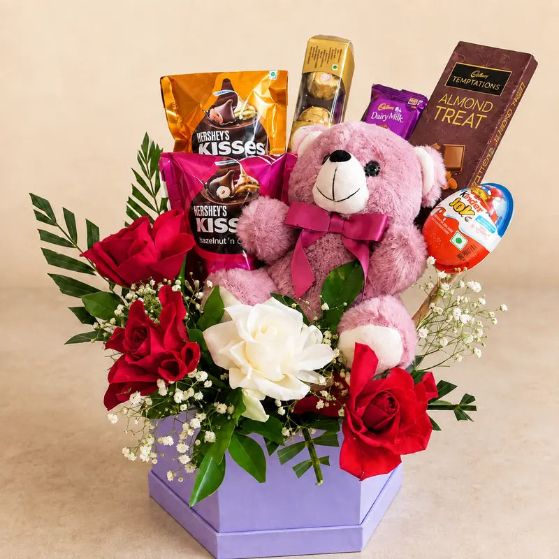 Pink teddy bear with red and white roses and chocolates in lavender gift box