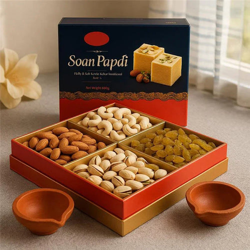 Soan Papdi gift box with almonds, cashews, pistachios, raisins and clay diyas, festive setup