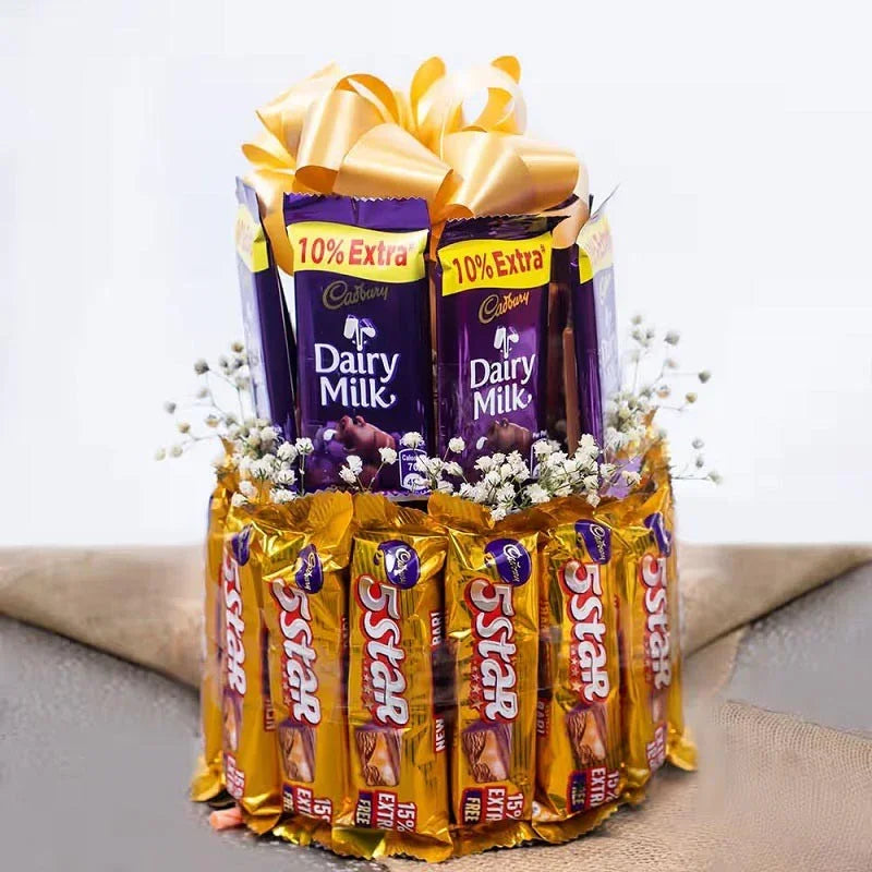 Bouquet of Cadbury Dairy Milk and Nestle Star chocolate bars with decorative ribbons and flowers.